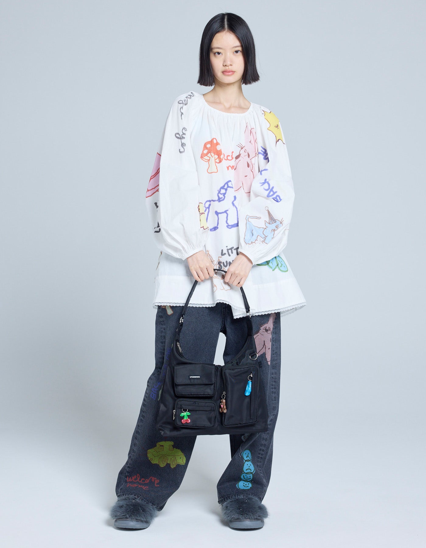 Tiny Bite / タイニーバイト　ネイタルデザイン little sunny bite (リトルサニーバイト)pocket bag / BLACK – little